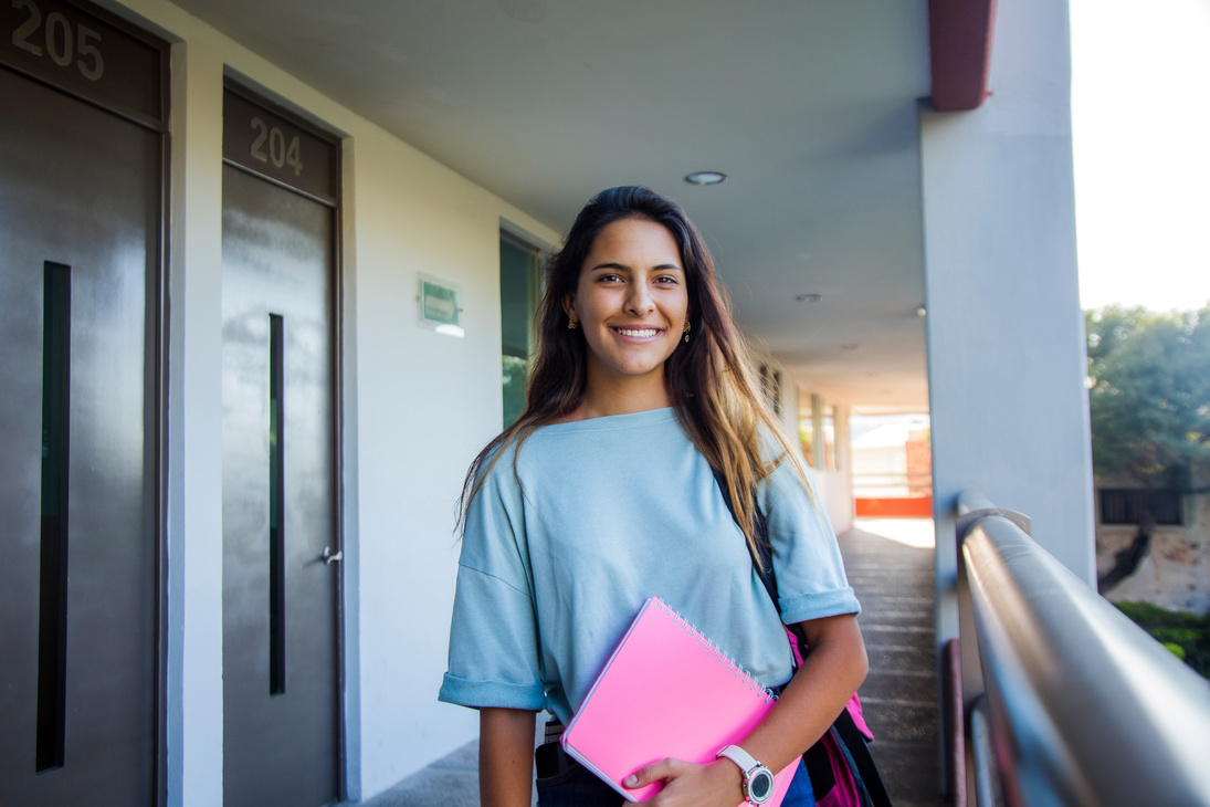 Latino college student out of class