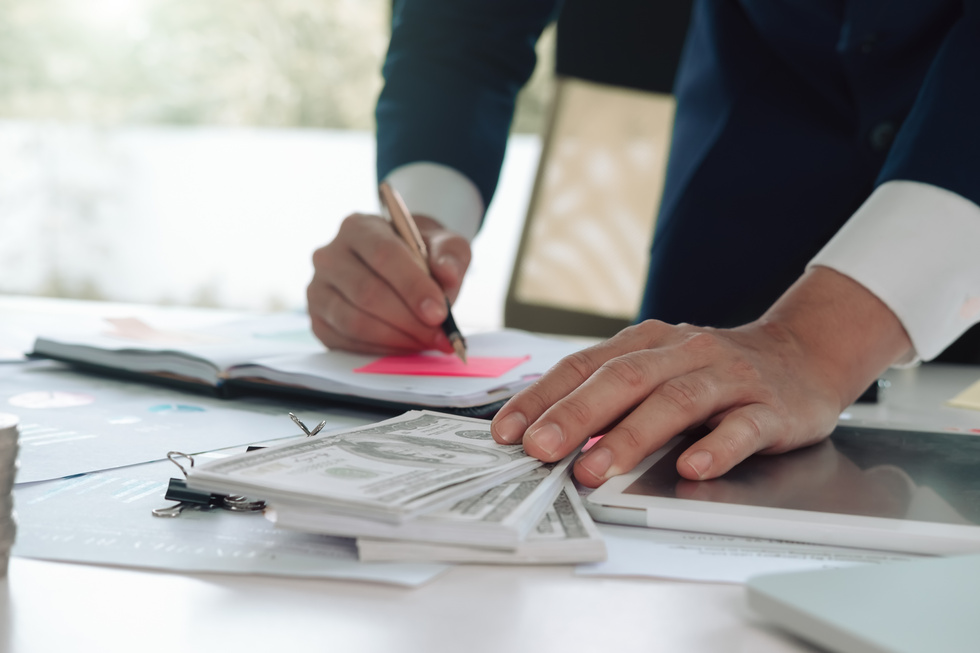 Man Analyzing the Financial Costs of Company